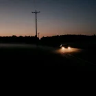car driving in the dusk light