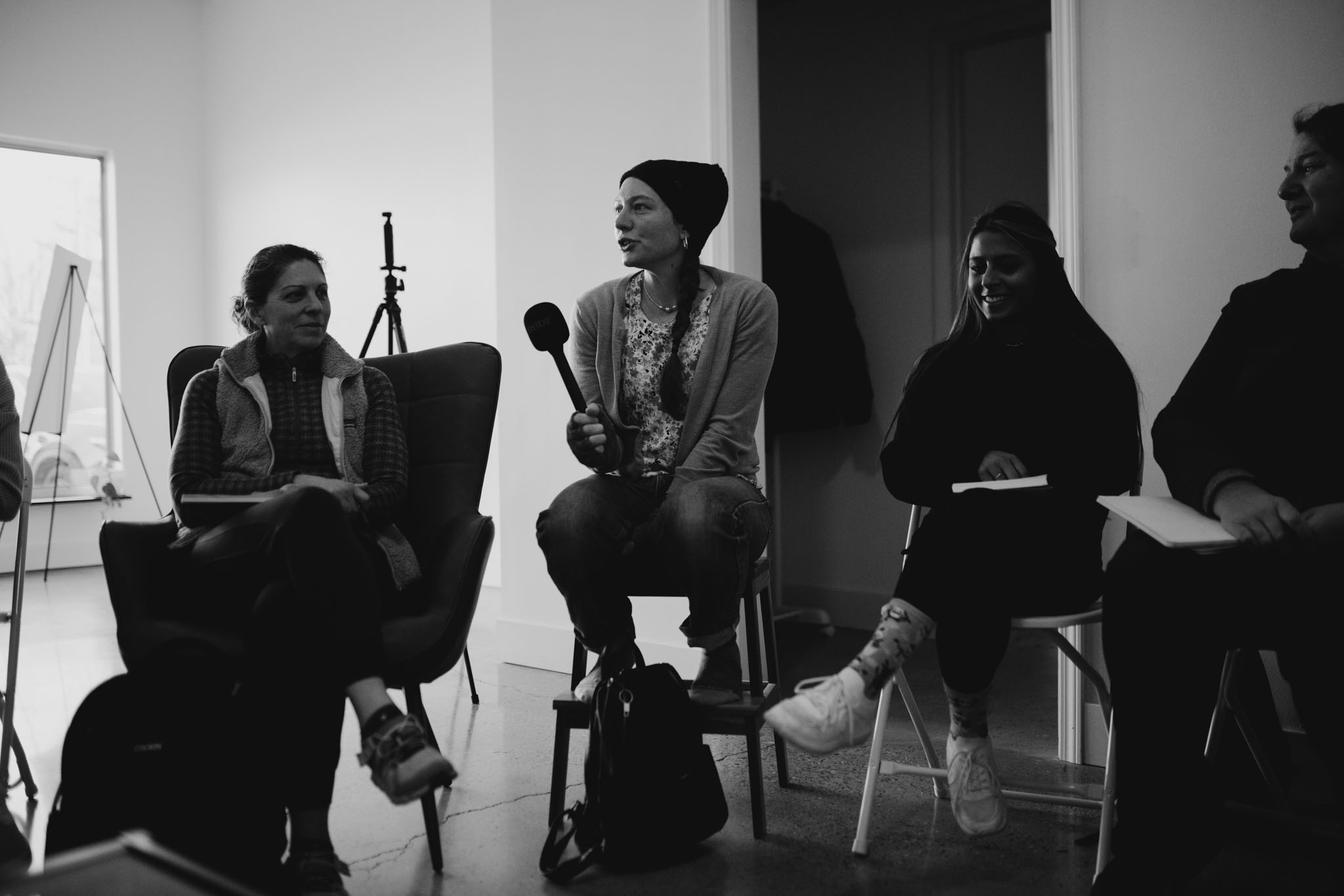 Photography Students Sitting in a circle, introducing themselves to the group